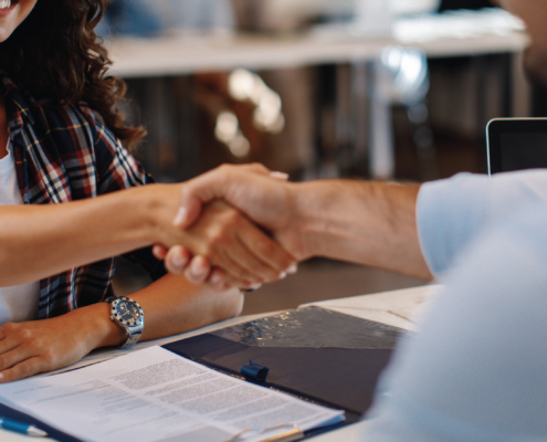 Handshake between financial advisor and client